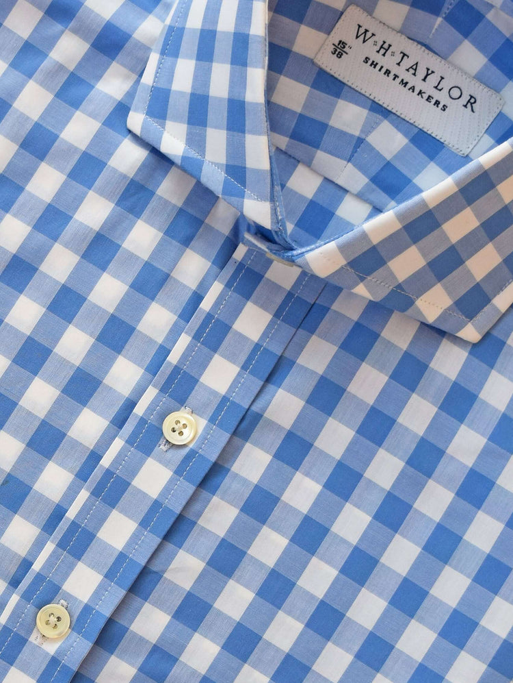 Light blue and white checkered bespoke shirt made from fine 100% cotton fabric, perfect for informal garments.